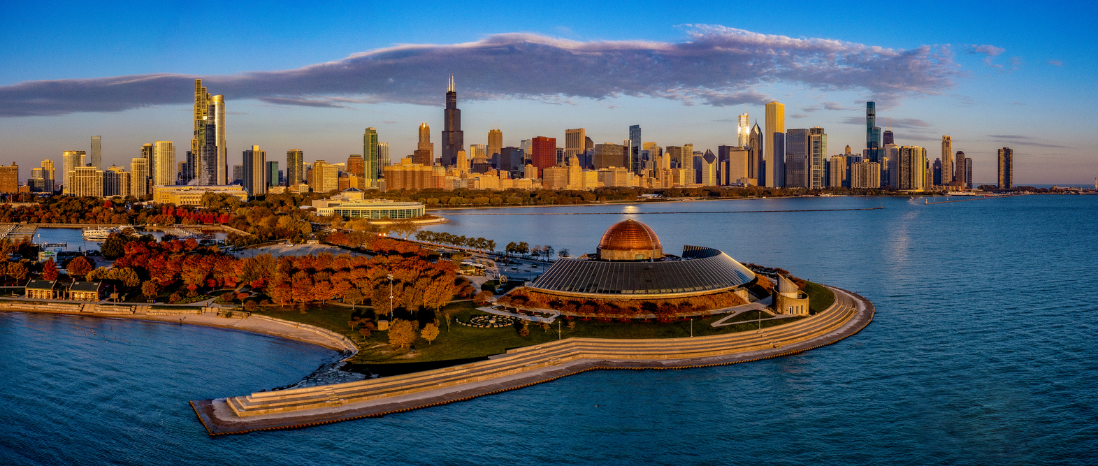 image of Chicago skyline with Adler Planetarium in the foreground