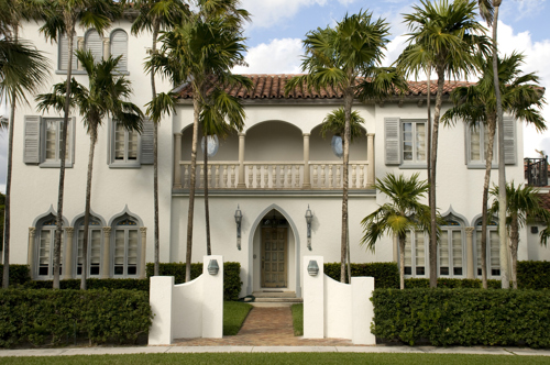 luxury home with balcony and palm trees in one of the best neighborhoods in west palm beach