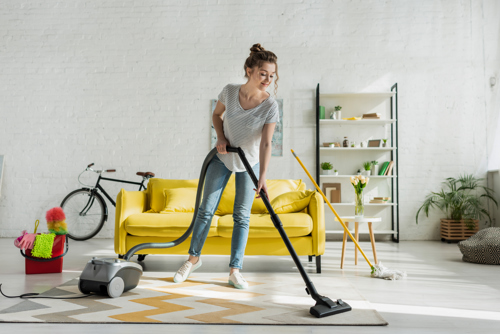 woman vacuuming home