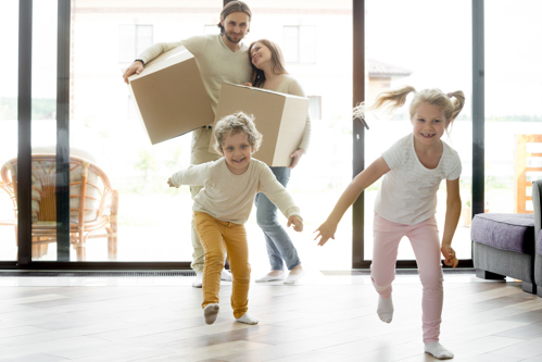 family entering new home with excitement