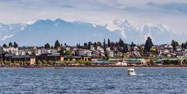 Image of Everett Washington from the bay with snow-capped mountains in distance