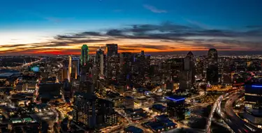 Image of Dallas/Ft. Worth skyline during a beautiful sunset | SmartStop