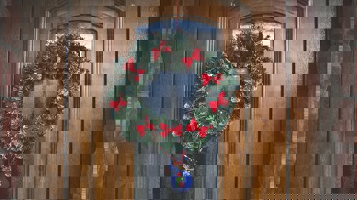 holiday wreath hanging on door