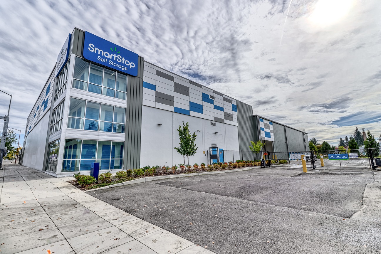 Image of a SmartStop building exterior with green grass and blue sky