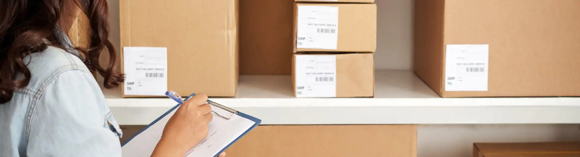 woman taking inventory with clipboard