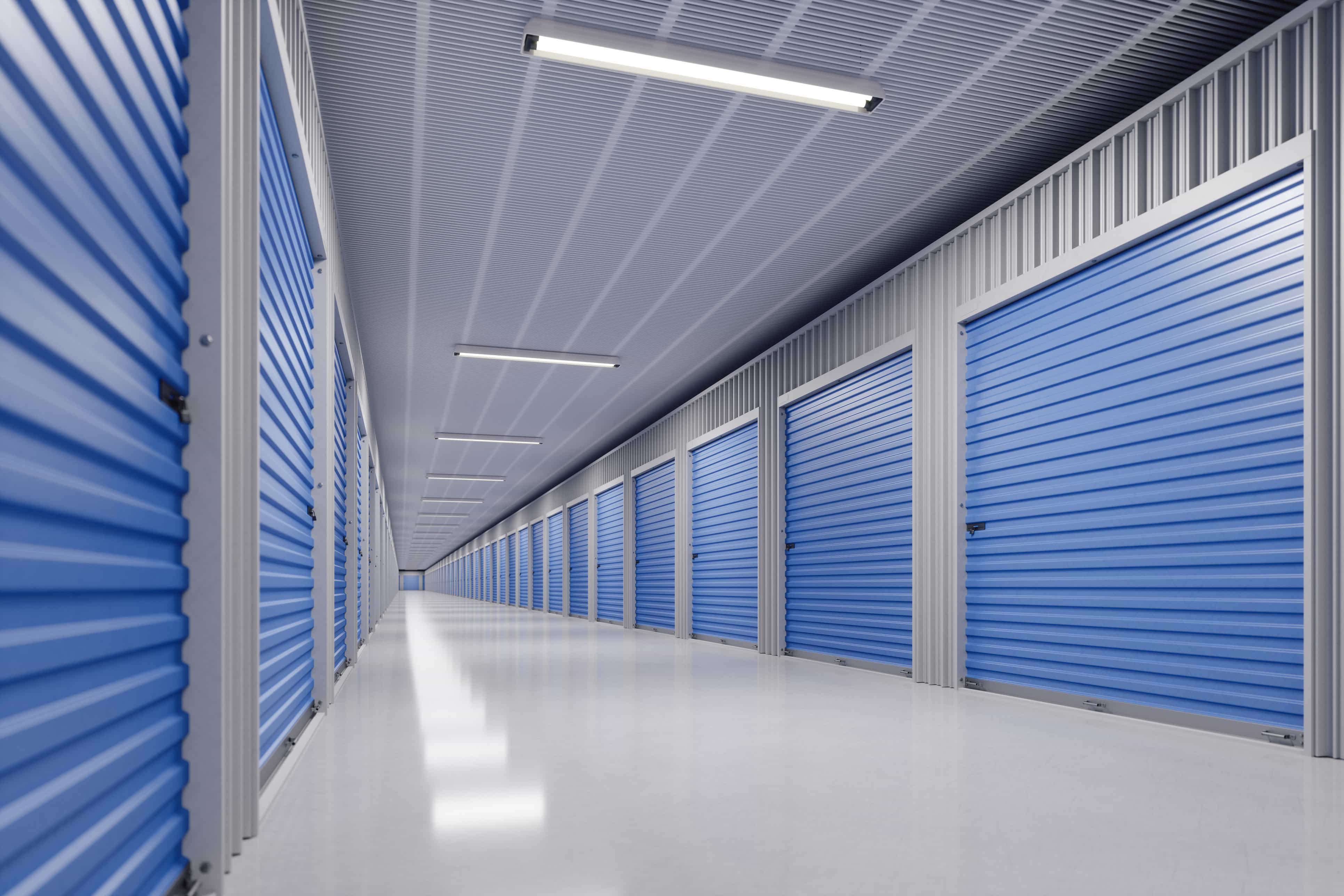 inside of storage facility hallway with blue storage unit doors