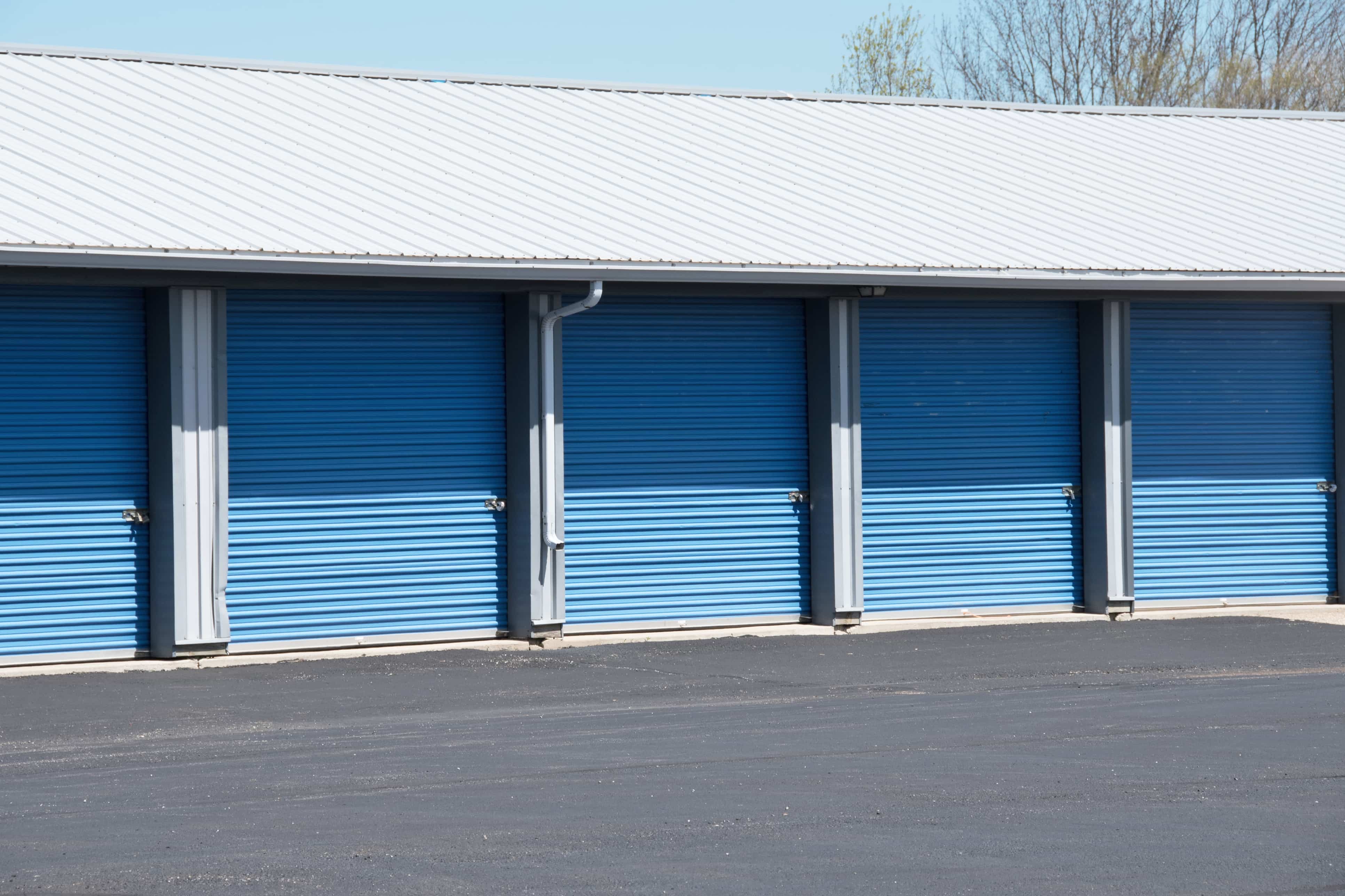 outdoor drive-up storage units with blue doors