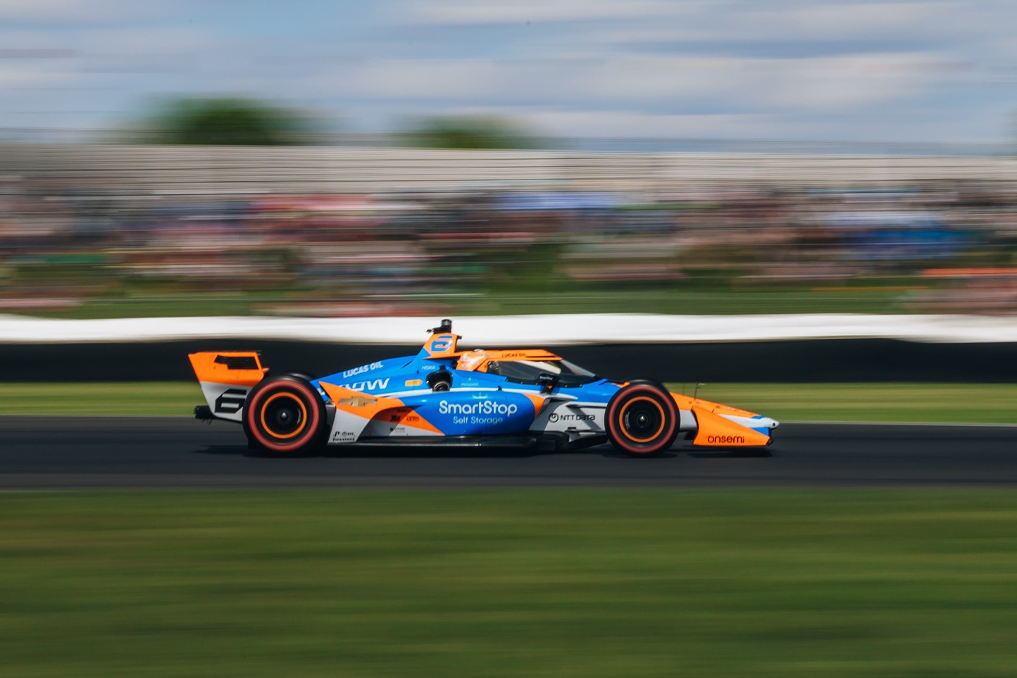 Image of McLaren Indycar racing on the track