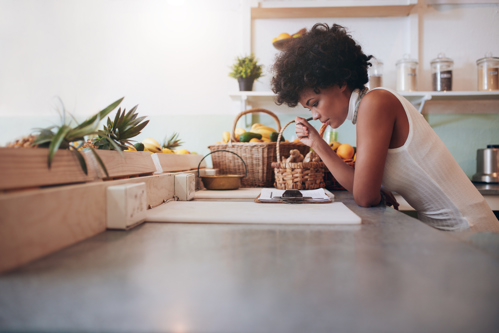 woman reviewing her detailed cleaning checklist