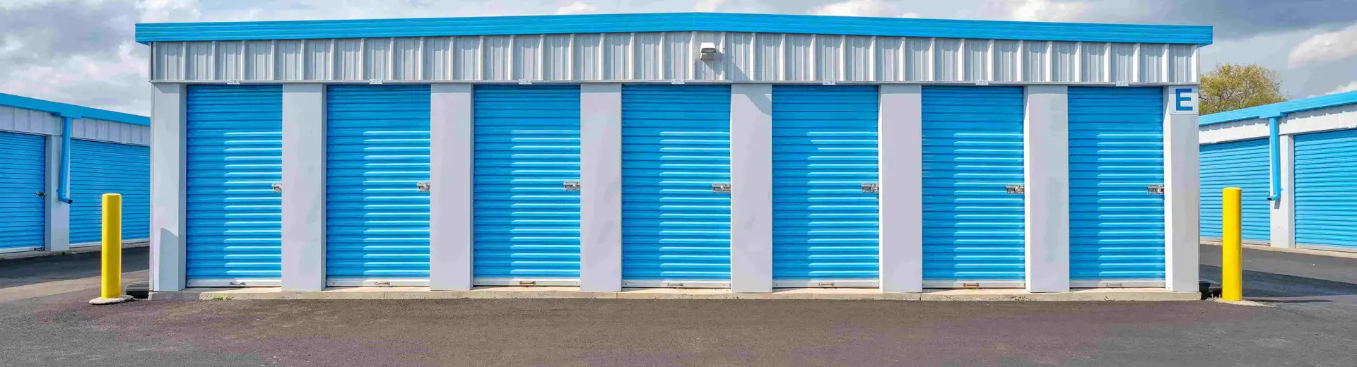 drive-up storage units with blue doors and roofs