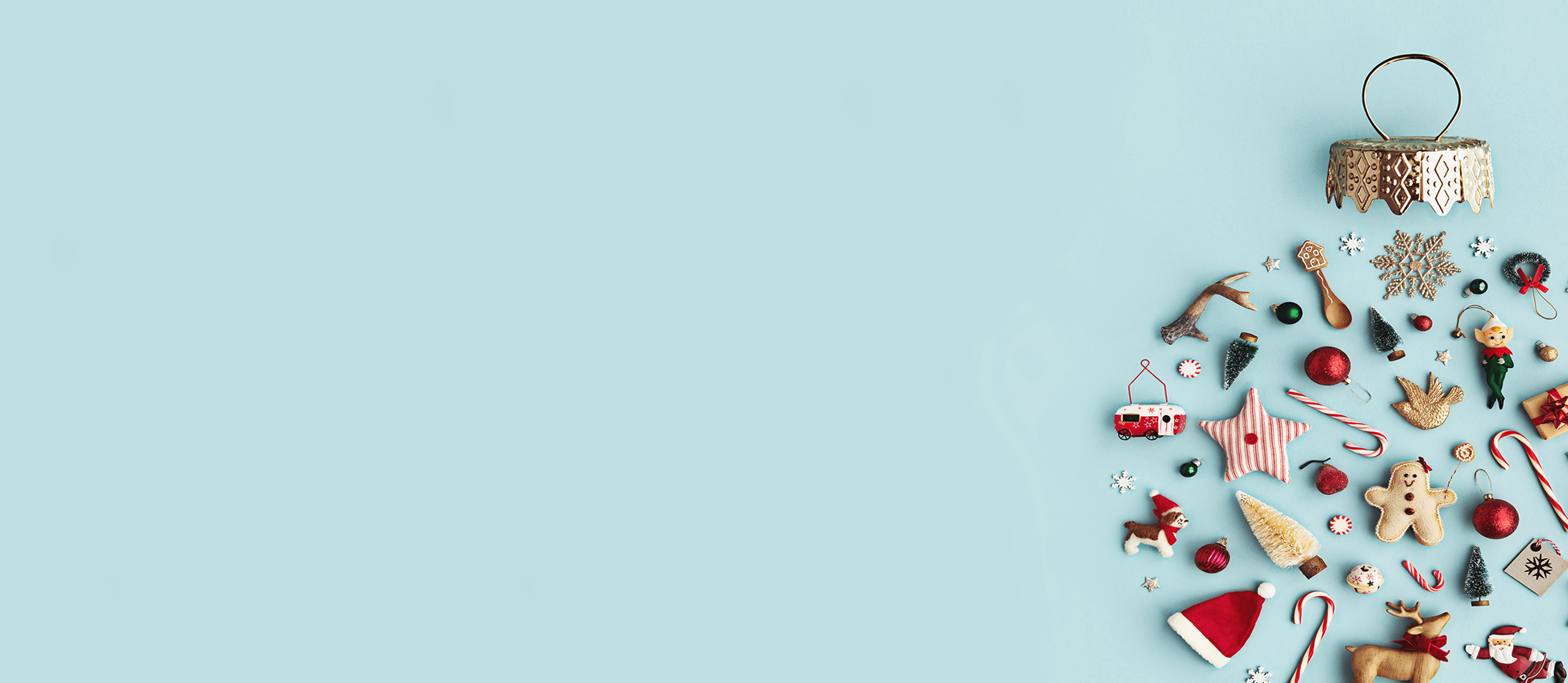 Image of various ornaments spread onto the floor and shaped as an ornament as a group