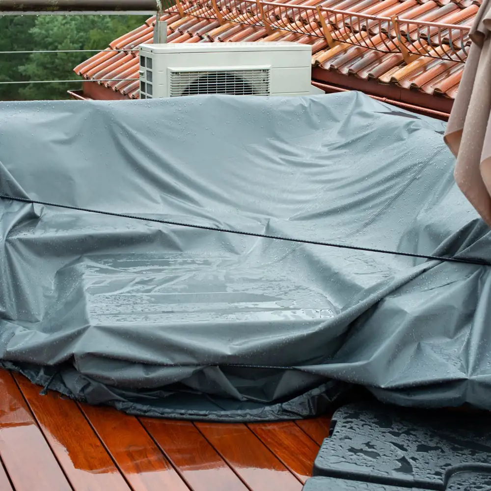 covered patio furniture on a rainy day