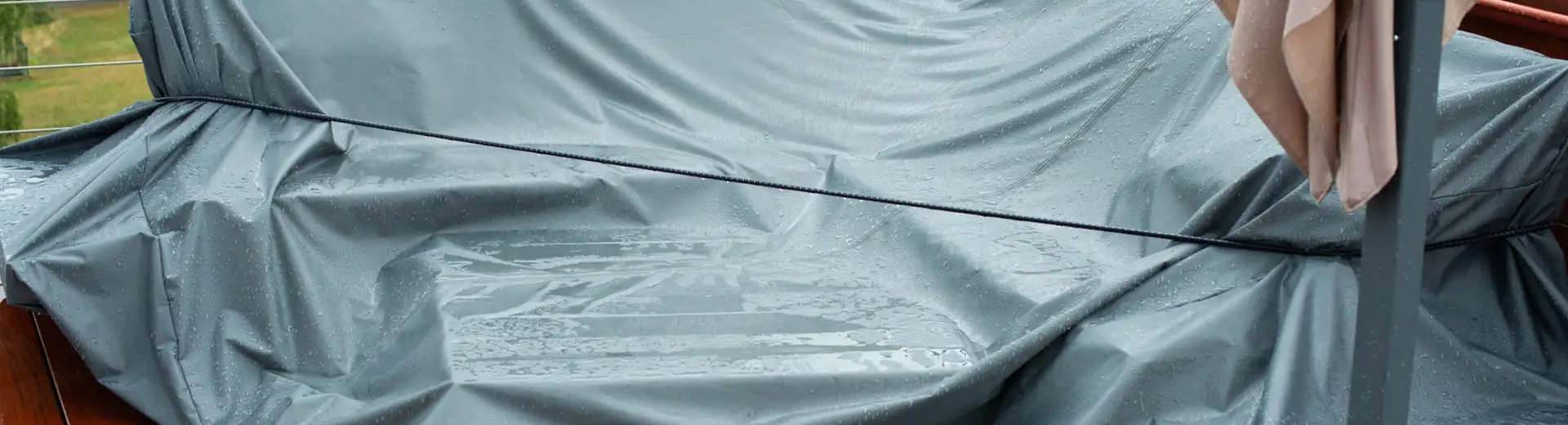 covered patio furniture on a rainy day