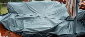 covered patio furniture on a rainy day