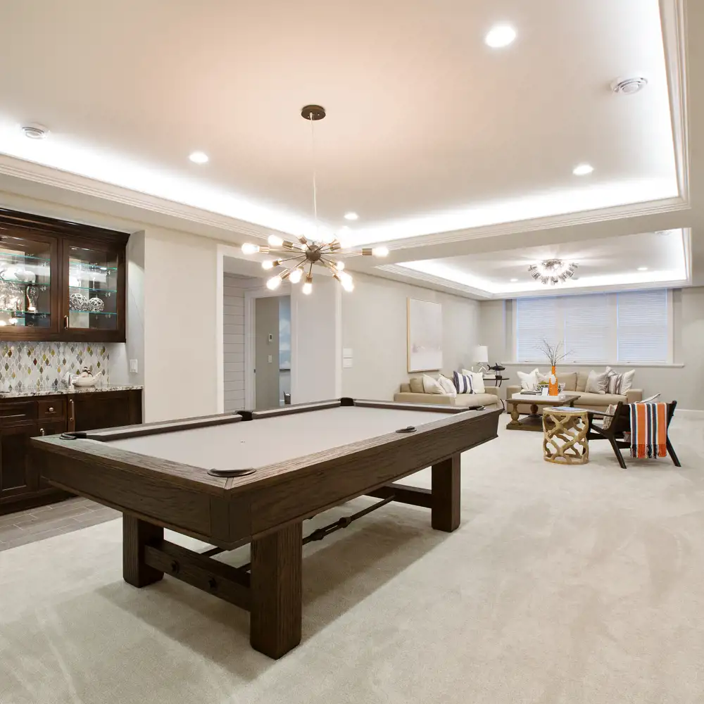 basement game room outfitted with pool table and couch