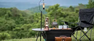camping gear setup on hillside