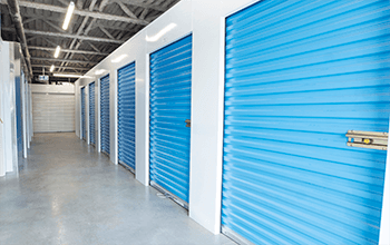 Image of an interior hallway surrounded by closed storage units