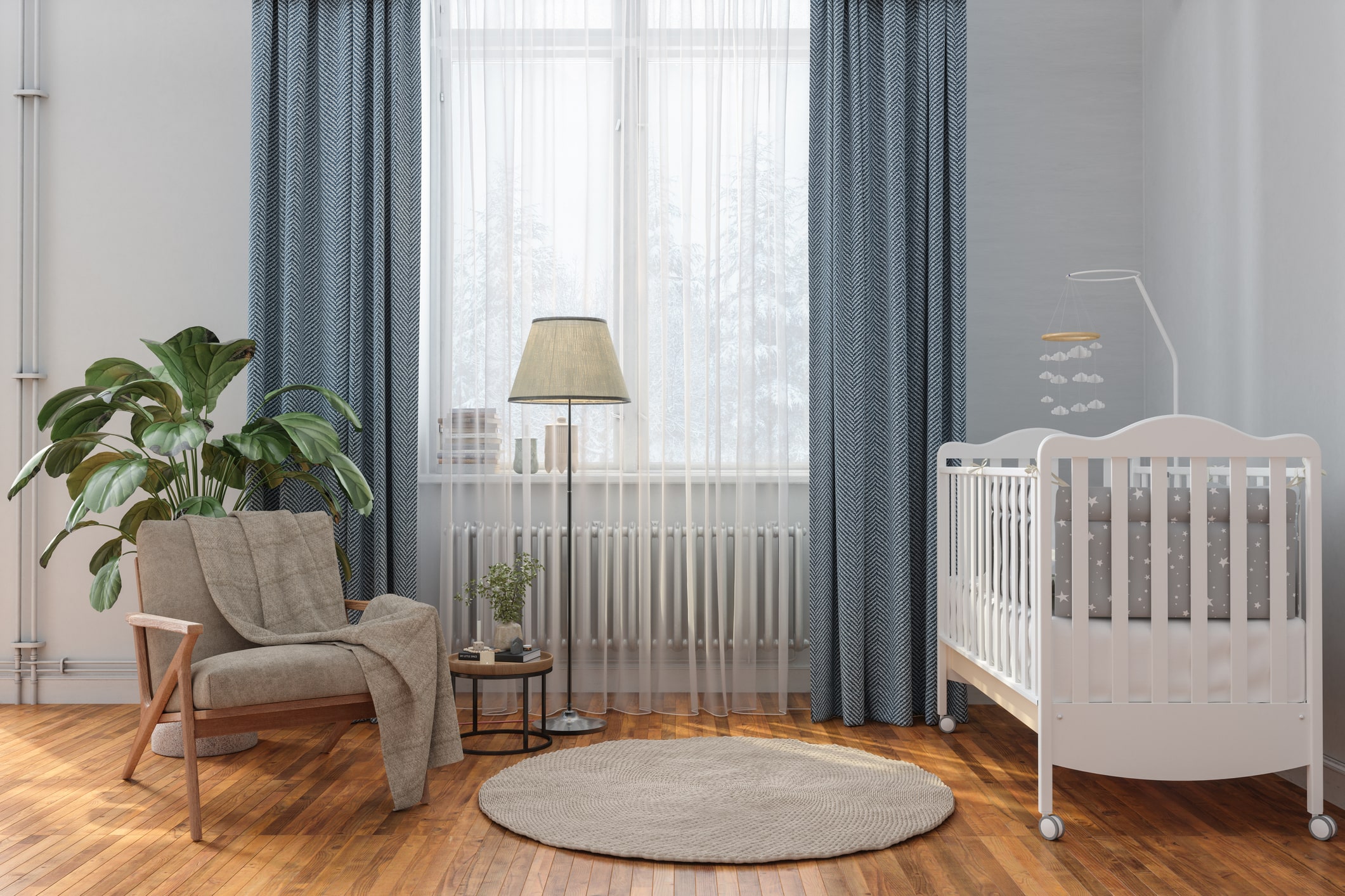 nursery with crib, armchair, lamp, rug, and hardwood floor
