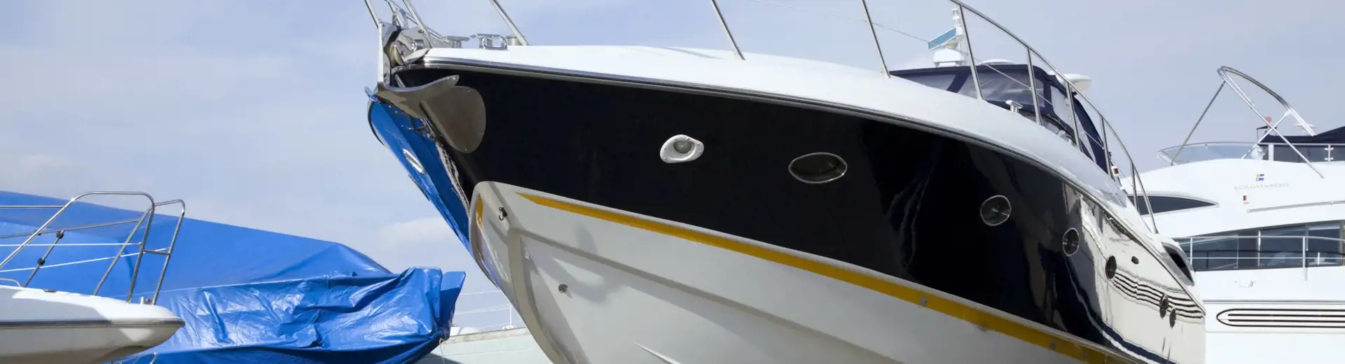 parked boats in a storage lot