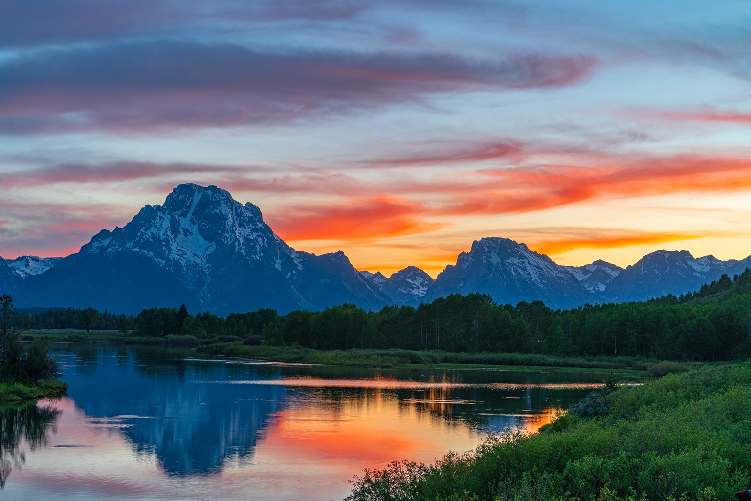 Image of lake and mountains of Grand Teton National Park at sunset