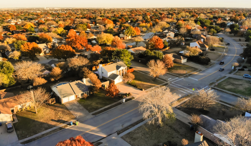 houses and autumn foliage in dallas suburb