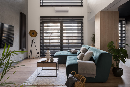 living room with interior window shutters to reduce energy use