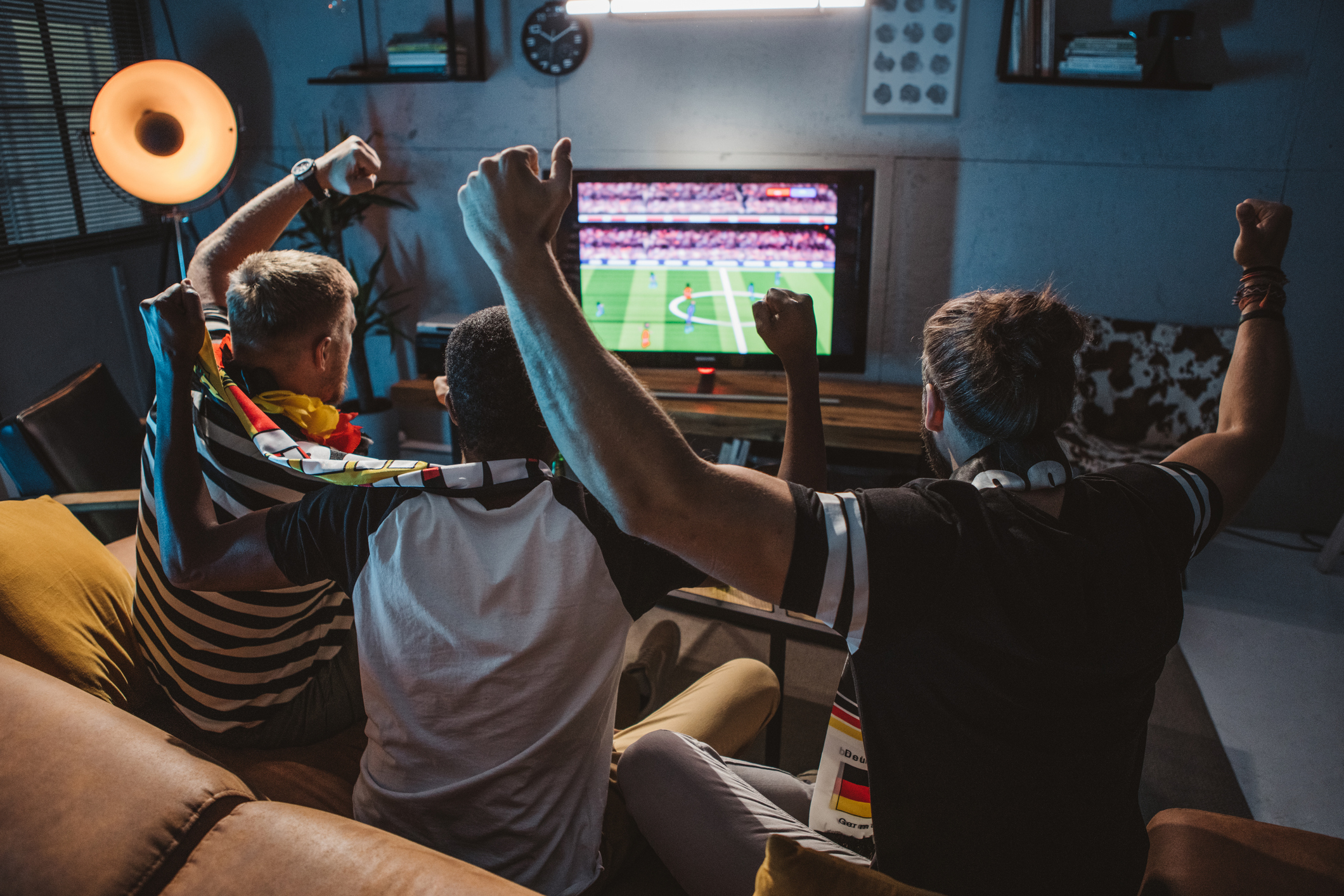 group of male friends watching sports
