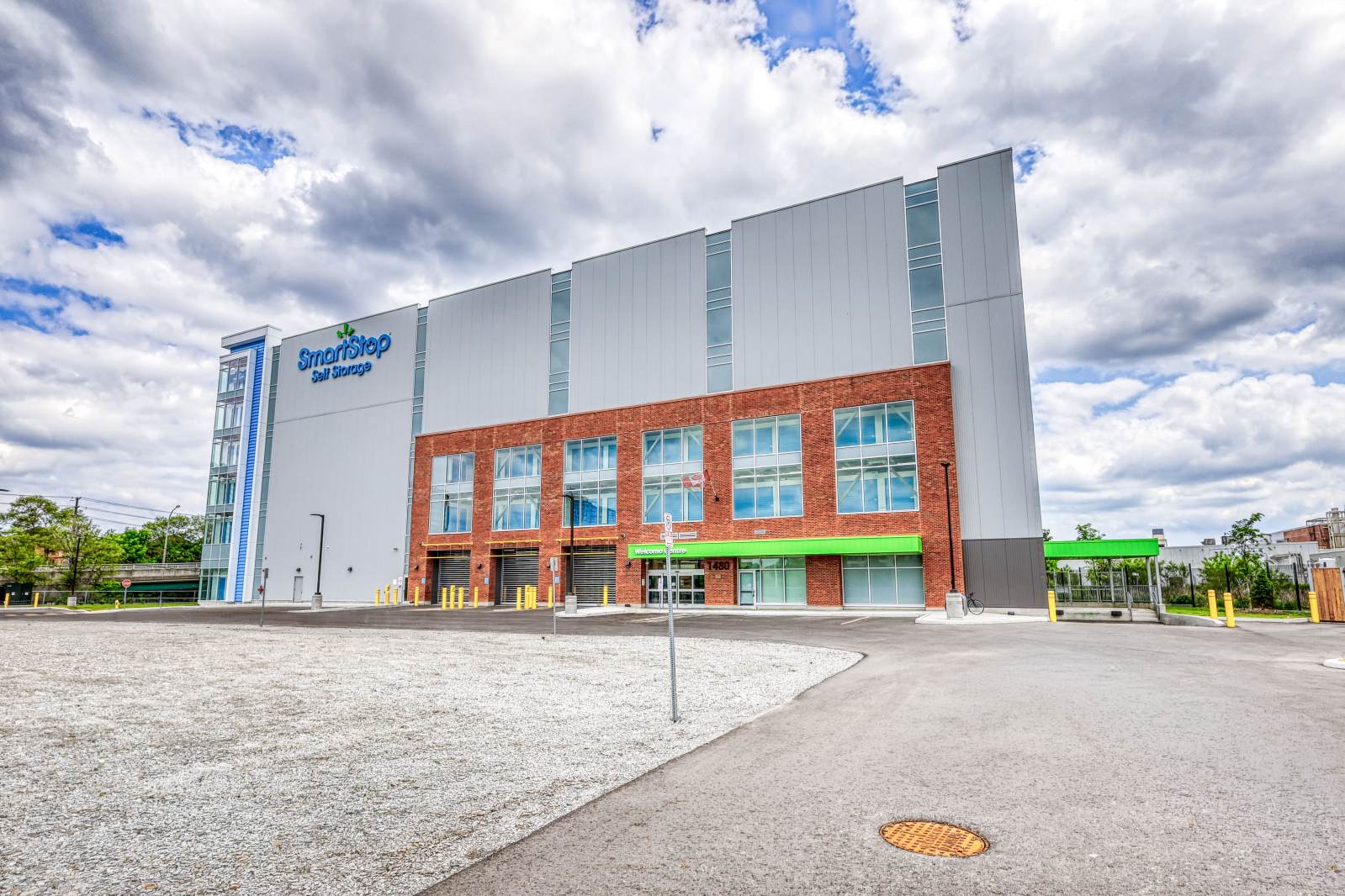 The front exterior of modern brick entry at SmartStop self storage facility in Toronto, Ontario on 1480 Jane St.
