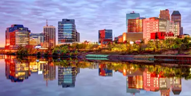 Image of Newark NJ city skyline at sunset