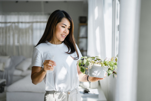 woman caring for her plants
