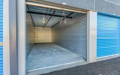 image of drive up storage unit with door open to show the interior of the unit | SmartStop