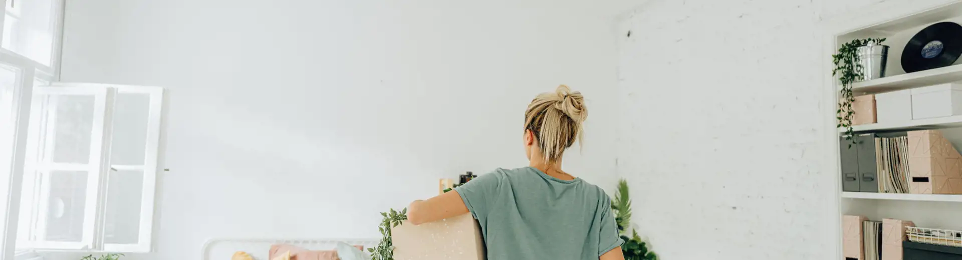 woman reorganizing bedroom