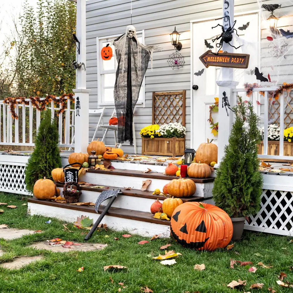 home porch filled with jack-o-lanterns and halloween decorations