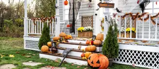home porch filled with jack-o-lanterns and halloween decorations