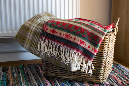 wicker basket with two folded blankets