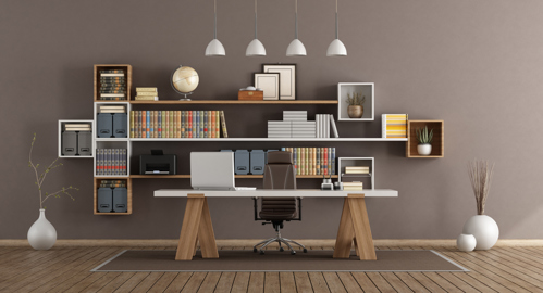 modern home office with wooden desk, chair, and wall shelves filled with books and decor