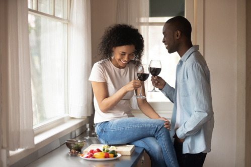 couple sharing some wine and snacks