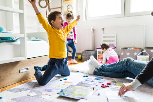 Family playing a board game.