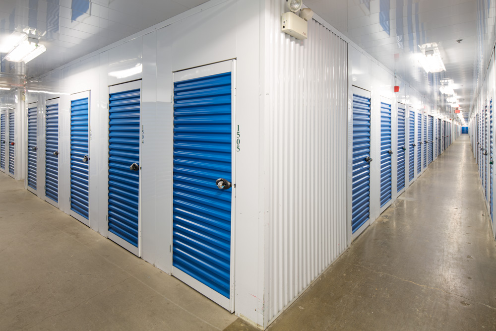 image of hallway of storage units with blue doors