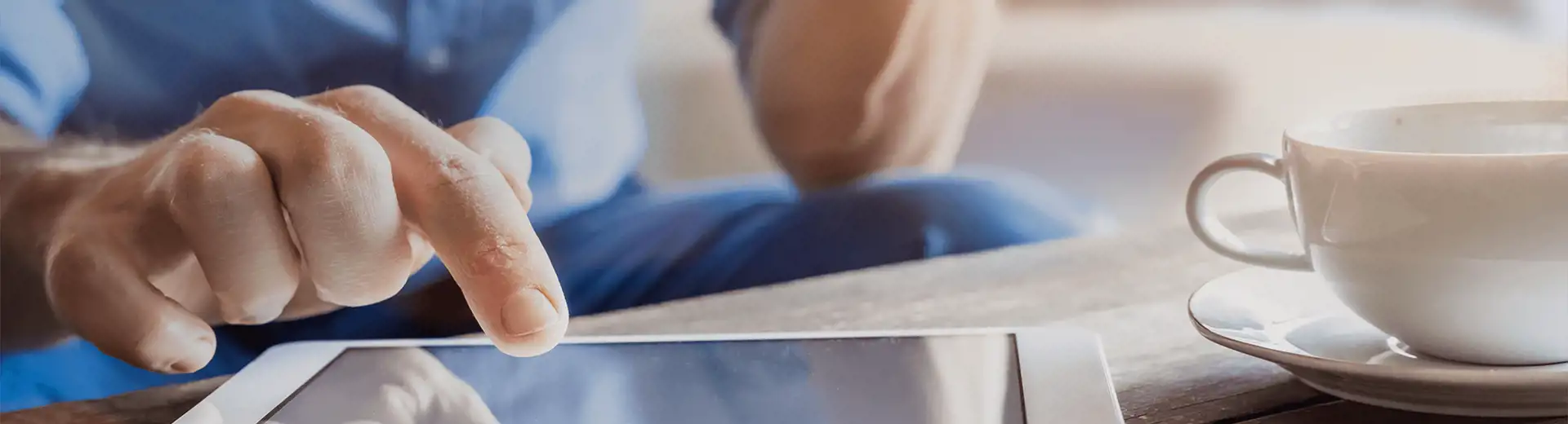 Image of man using computer tablet